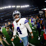 ARLINGTON, TEXAS - NOVEMBER 30:  Quarterback Dak Prescott #4 of the Dallas Cowboys walks off the field after the game against the Seattle Seahawks at AT&T Stadium on November 30, 2023 in Arlington, Texas. (Photo by Ron Jenkins/Getty Images)