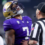 LAS VEGAS, NEVADA - DECEMBER 01: Dillon Johnson #7 of the Washington Huskies yells after scoring a rushing touchdown during the first quarter against the Oregon Ducks during the Pac-12 Championship at Allegiant Stadium on December 01, 2023 in Las Vegas, Nevada. (Photo by Ian Maule/Getty Images)