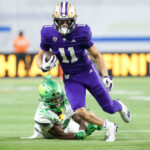 LAS VEGAS, NEVADA - DECEMBER 01: Jalen McMillan #11 of the Washington Huskies runs past Khyree Jackson #5 of the Oregon Ducks during the second quarter during the Pac-12 Championship at Allegiant Stadium on December 01, 2023 in Las Vegas, Nevada. (Photo by Ian Maule/Getty Images)