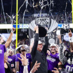 LAS VEGAS, NEVADA - DECEMBER 01: Head coach Kalen DeBoer of the Washington Huskies celebrates with his team while lifting the Pac-12 Championship trophy after his team's win 34-31 against the Oregon Ducks during the Pac-12 Championship at Allegiant Stadium on December 01, 2023 in Las Vegas, Nevada. (Photo by Ian Maule/Getty Images)