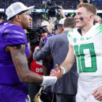 LAS VEGAS, NEVADA - DECEMBER 01: Michael Penix Jr. #9 of the Washington Huskies and Bo Nix #10 of the Oregon Ducks shake hands after Washington's win 34-31 during the Pac-12 Championship at Allegiant Stadium on December 01, 2023 in Las Vegas, Nevada. (Photo by Ian Maule/Getty Images)