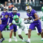 LAS VEGAS, NEVADA - DECEMBER 01: Dillon Johnson #7 of the Washington Huskies runs for a game clinching first down during the fourth quarter against the Oregon Ducks during the Pac-12 Championship at Allegiant Stadium on December 01, 2023 in Las Vegas, Nevada. (Photo by Ian Maule/Getty Images)