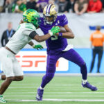 LAS VEGAS, NEVADA - DECEMBER 01: Jamal Hill #9 of the Oregon Ducks tackles Michael Penix Jr. #9 of the Washington Huskies during the fourth quarter during the Pac-12 Championship at Allegiant Stadium on December 01, 2023 in Las Vegas, Nevada. (Photo by Ian Maule/Getty Images)