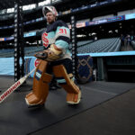 SEATTLE, WASHINGTON - DECEMBER 31: Philipp Grubauer of the Seattle Kraken looks on during practice before the Discover NHL Winter Classic at T-Mobile Park on December 31, 2023 in Seattle, Washington. (Photo by Steph Chambers/Getty Images)
