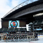 SEATTLE, WASHINGTON - DECEMBER 31: The Seattle Kraken pose for a team picture during practice before the Discover NHL Winter Classic at T-Mobile Park on December 31, 2023 in Seattle, Washington. (Photo by Steph Chambers/Getty Images)