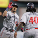 HOUSTON, TEXAS - OCTOBER 07: Jorge Polanco #11 of the Minnesota Twins celebrates with third base coach Tommy Watkins #40 after a home run during the seventh inning against the Houston Astros during Game One of the Division Series at Minute Maid Park on October 07, 2023 in Houston, Texas. (Photo by Carmen Mandato/Getty Images)