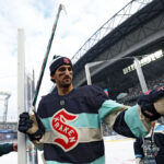 SEATTLE, WASHINGTON - JANUARY 01:  Matty Beniers #10 of the Seattle Kraken warms up prior to the game against the Vegas Golden Knights at T-Mobile Park on January 01, 2024 in Seattle, Washington. (Photo by Steph Chambers/Getty Images)