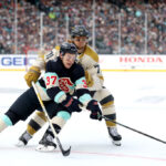 SEATTLE, WASHINGTON - JANUARY 01:  Yanni Gourde #37 of the Seattle Kraken and William Karlsson #71 of the Vegas Golden Knights battle for the puck during the first period at T-Mobile Park on January 01, 2024 in Seattle, Washington. (Photo by Steph Chambers/Getty Images)