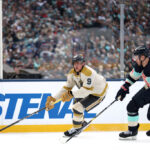 SEATTLE, WASHINGTON - JANUARY 01:  Jack Eichel #9 of the Vegas Golden Knights is pursued by Jamie Oleksiak #24 of the Seattle Kraken during the first period at T-Mobile Park on January 01, 2024 in Seattle, Washington. (Photo by Steph Chambers/Getty Images)