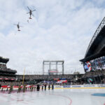 SEATTLE, WASHINGTON - JANUARY 01:  A view of a Navy Rescue pre-game flyover prior to the game between the Seattle Kraken and the Vegas Golden Knights at T-Mobile Park on January 01, 2024 in Seattle, Washington. (Photo by Steph Chambers/Getty Images)