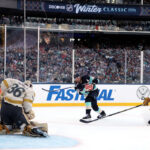 SEATTLE, WASHINGTON - JANUARY 01:  Logan Thompson #36 of the Vegas Golden Knights makes a save against Jordan Eberle #7 of the Seattle Kraken during the second period at T-Mobile Park on January 01, 2024 in Seattle, Washington. (Photo by Steph Chambers/Getty Images)