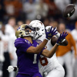 NEW ORLEANS, LOUISIANA - JANUARY 01: Rome Odunze #1 of the Washington Huskies catches a pass against Ryan Watts #6 of the Texas Longhorns during the second quarter during the CFP Semifinal Allstate Sugar Bowl at Caesars Superdome on January 01, 2024 in New Orleans, Louisiana. (Photo by Sean Gardner/Getty Images)