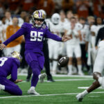NEW ORLEANS, LOUISIANA - JANUARY 01: Grady Gross #95 of the Washington Huskies kicks a field goal during the fourth quarter against the Texas Longhorns during the CFP Semifinal Allstate Sugar Bowl at Caesars Superdome on January 01, 2024 in New Orleans, Louisiana. (Photo by Chris Graythen/Getty Images)
