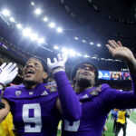 NEW ORLEANS, LOUISIANA - JANUARY 01: Thaddeus Dixon #9 of the Washington Huskies and Davon Banks #6 celebrate after a 37-31 victory against the Texas Longhorns in the CFP Semifinal Allstate Sugar Bowl at Caesars Superdome on January 01, 2024 in New Orleans, Louisiana. (Photo by Jonathan Bachman/Getty Images)