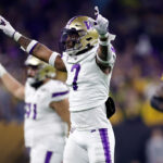HOUSTON, TEXAS - JANUARY 08: Dominique Hampton #7 of the Washington Huskies reacts after a defensive stop in the second quarter against the Michigan Wolverines during the 2024 CFP National Championship game at NRG Stadium on January 08, 2024 in Houston, Texas. (Photo by Carmen Mandato/Getty Images)