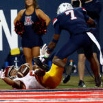 TUCSON, ARIZONA - OCTOBER 29: Wide receiver Brenden Rice #2 of the USC Trojans can't hang on to a pass while being defended by cornerback Ephesians Prysock #7 of the Arizona Wildcats during the second half at Arizona Stadium on October 29, 2022 in Tucson, Arizona. (Photo by Chris Coduto/Getty Images)