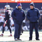 FOXBOROUGH, MASSACHUSETTS - DECEMBER 24: Outside linebackers coach Steve Belichick of the New England Patriots and head coach Bill Belichick of the New England Patriots talk during pregame against the Cincinnati Bengals at Gillette Stadium on December 24, 2022 in Foxborough, Massachusetts. (Photo by Winslow Townson/Getty Images)