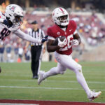 STANFORD, CALIFORNIA - SEPTEMBER 23: Sedrick Irvin #26 of the Stanford Cardinal rushes the ball for a touchdown as Russell Davis II #99 of the Arizona Wildcats fails to stop him during the second half of the game at Stanford Stadium on September 23, 2023 in Stanford, California. (Photo by Loren Elliott/Getty Images)