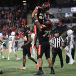 PORTLAND, OREGON - SEPTEMBER 17: Kanoa Shannon #29 of the Oregon State Beavers is lifted in the air by teammate Taliese Fuaga #75 after scoring touchdown against the Montana State Bobcats during the fourth quarter at Providence Park on September 17, 2022 in Portland, Oregon. (Photo by Amanda Loman/Getty Images)