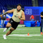 INDIANAPOLIS, INDIANA - MARCH 03: Troy Fautanu #OL19 of Washington participates in a drill during the NFL Combine at Lucas Oil Stadium on March 03, 2024 in Indianapolis, Indiana. (Photo by Justin Casterline/Getty Images)