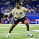 INDIANAPOLIS, INDIANA - MARCH 03: Christian Haynes #OL33 of Connecticut participates in a drill during the NFL Combine at Lucas Oil Stadium on March 03, 2024 in Indianapolis, Indiana. (Photo by Justin Casterline/Getty Images)