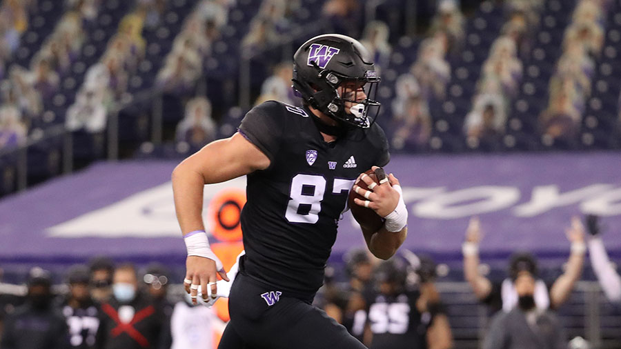 UW Huskies uniforms blackout black all Cade Otton...