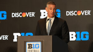 Big Ten bars football players with pro contracts from returning to play