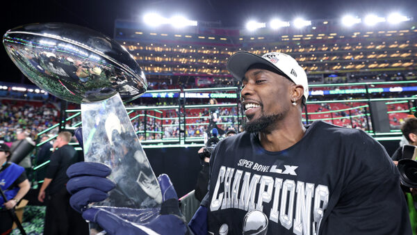 Seattle Seahawks DeMarcus Lawrence looks at Super Bowl trophy 2026