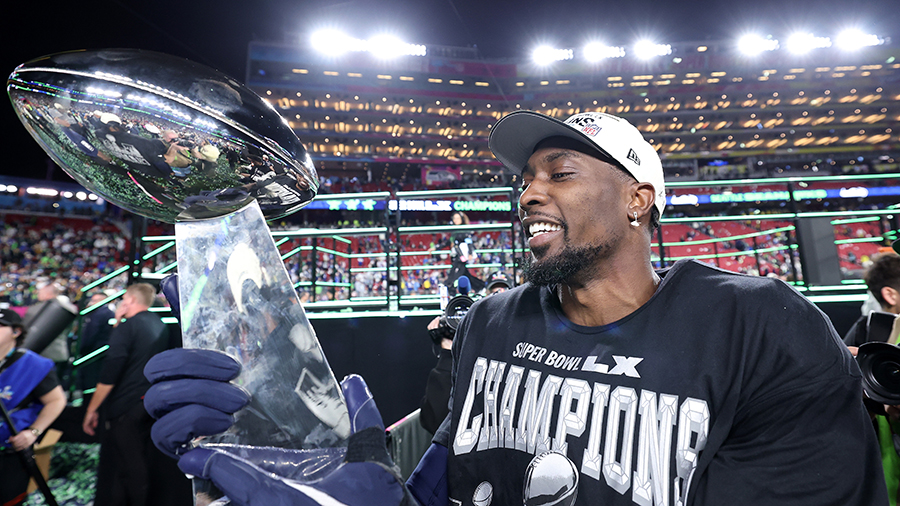 Seattle Seahawks DeMarcus Lawrence looks at Super Bowl trophy 2026...
