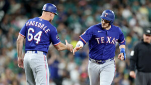 Rangers slug three HRs, beat Mariners 10-5