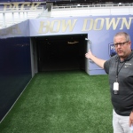 Jeff Bechthold, UW Director of Athletic Communications, stands at the tunnel entrance at Husky Stadium. 