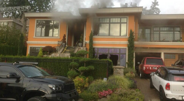 Firefighters have put out a blaze that broke out at a Bellevue home neighbors say belongs to Marine...