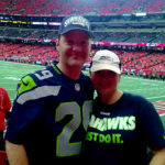 Seahawks fans Ben and Jennifer Williams show their colors in the Georgia Dome in Atlanta before Sunday's Seattle win over the Falcons.