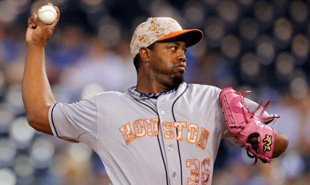 Houston Astros relief pitcher Jerome Williams uses a pink mitt as a tribute to his mother. (AP)...