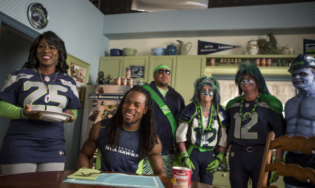 Richard and Beverly Sherman are flanked by super Seahawks fans Cedric James Morris (left) DeDe and ...