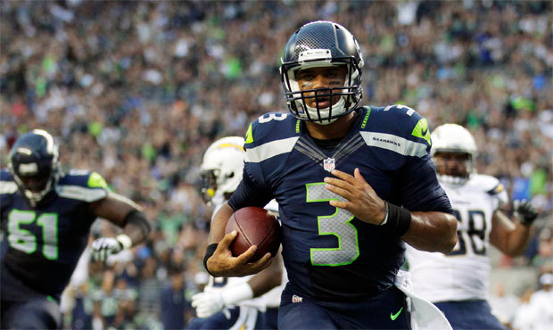 Russell Wilson and Seattle’s other quarterbacks combined to rush for 99 yards and four touchd...