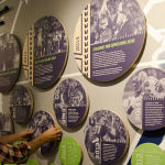 An EMP Museum staffer prepares the new exhibition "We Are 12: The Seattle Seahawks and the Road to Victory."