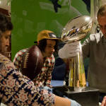 EMP Museum staff prepare the Lombardi Trophy for display in the new exhibition "We Are 12: The Seattle Seahawks and the Road to Victory."