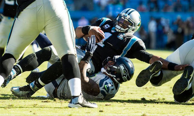 Bruce Irvin recorded sacks on back-to-back plays during Carolina’s final drive. (Rod Mar/Seah...
