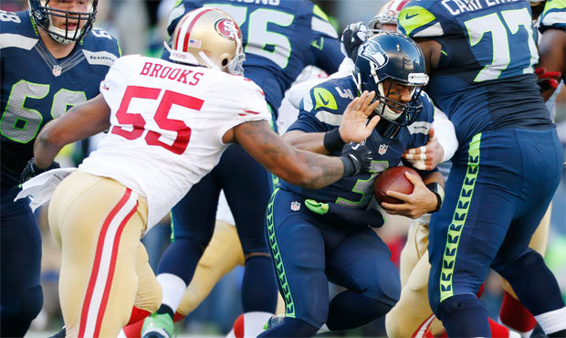 Russell Wilson was sacked five times and picked off once during a unimpressive day for Seattle&#821...