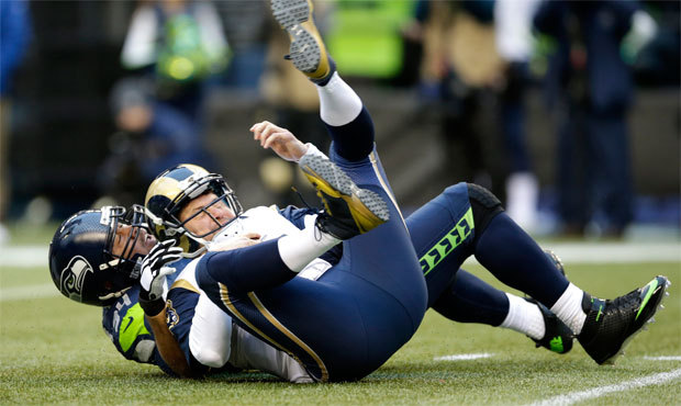 Shaun Hill was sacked four times and picked off twice as the Rams were held without a touchdown. (A...
