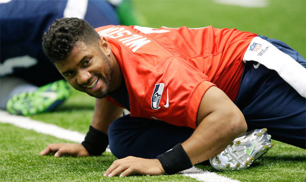 Russell Wilson provided clich? answers and not many clues as to how he feels about his contract sit...