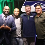 Doug Baldwin poses with 710 ESPN Seattle host Gee Scott, and former Seahawks players Dave Wyman and Paul Moyer during Seahawks Weekly from Pearl Bar & Dining in Bellevue's Lincoln Square on Thursday, November 12, 2015.