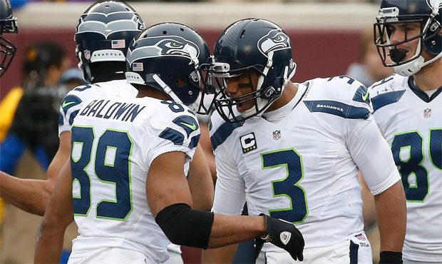 Russell Wilson threw for three more touchdowns and rushed for another in Seattle’s win over M...