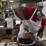 Demitrius Bronson bakes cookies and cakes in the Costco kitchen.