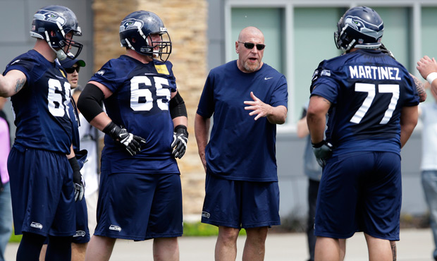 Tom Cable says his current group of lineman "just happens to be these big, powerful goons. And that...