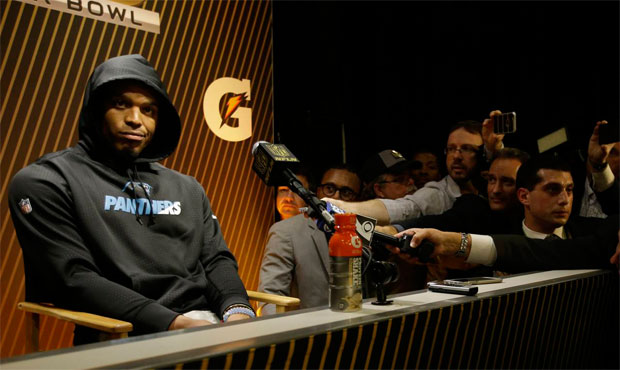 A dejected Cam Newton gave a few terse responses then walked out of his postgame press conference. ...