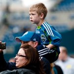 Young Sounders FC fan looks on as the team warms up prior to the match. 