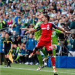 Sounders defender Tyson Wahl goes up for a header against Toronto FC central midfielder Maicon Santos. 