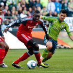 Toronto FC defender Dicoy Williams steals the ball from Sounders forward Fredy Montero and drops it back to Toronto goalkeeper Stefan Frei. 